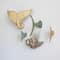 Hello Honey® 18" Distressed Aqua Tuna Tail Metal Wall Décor